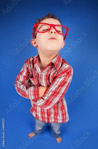 Photo: Funny portrait of a five years old sulky boy Funny portrait of a five years old sulky boy