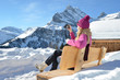 Girl with a camera in Swiss Alps