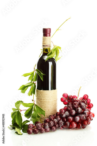 Photo: bottle of wine with grapes isolated on white bottle of wine with grapes isolated on white
