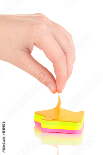 Photo: human hand holding sticker isolated on white human hand holding sticker isolated on white