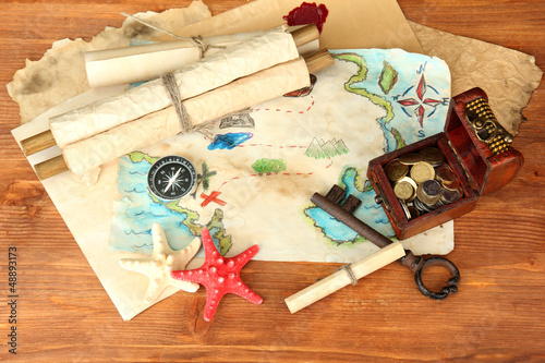 Photo: map of treasures on wooden background map of treasures on wooden background