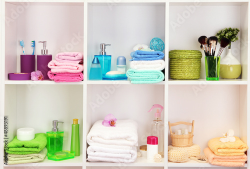 Photo: Bath accessories on shelfs in bathroom Bath accessories on shelfs in bathroom