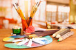 Artistic equipment: paint, brushes and art palette