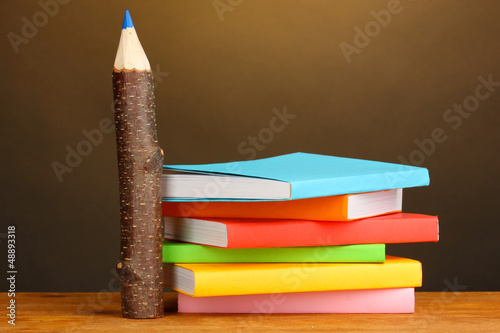 Photo: Colorful wooden pencils with books Colorful wooden pencils with books