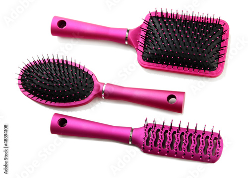 Photo: Comb brushes, isolated on white Comb brushes, isolated on white