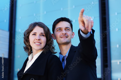 Photo: A couple of young business persons in formal clothes A couple of young business persons in formal clothes