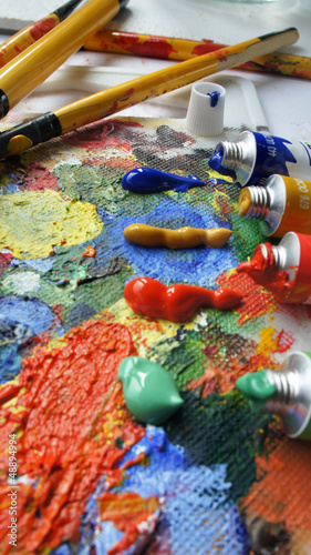 Photo: Tubes with paints and paintbrushes Tubes with paints and paintbrushes