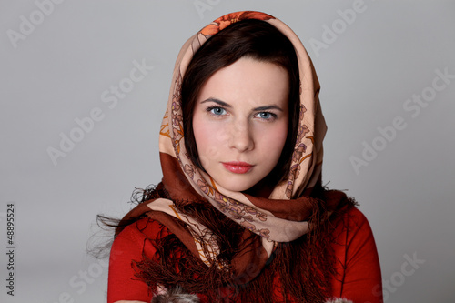 Photo: Beautiful woman on the red scarf Beautiful woman on the red scarf
