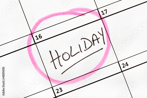 Photo: Holiday Date Marked on a Calendar. Holiday Date Marked on a Calendar.