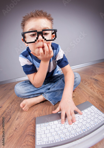 Photo: Little boy with laptop computer Little boy with laptop computer