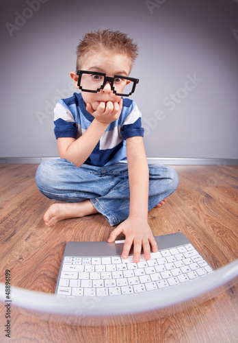 Photo: Little boy with laptop computer Little boy with laptop computer