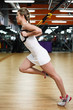 Young fit woman does suspension training