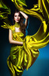 sensual sexy woman in green fabric on blue light