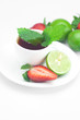 cup of tea,strawberry,mint and lime isolated on white