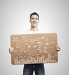 man holding poster with business concept