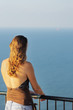 Portrait of young woman looking on sea