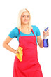 Female cleaner holding a liquid for spraying and a cloth