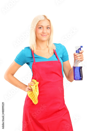 Photo: Female cleaner holding a liquid for spraying and a cloth Female cleaner holding a liquid for spraying and a cloth