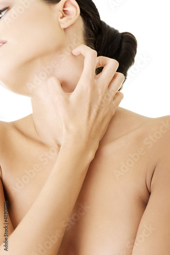 Photo: Young beautiful woman scratching her self. Young beautiful woman scratching her self.