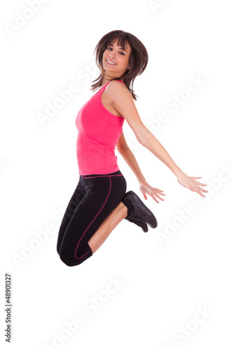 Photo: Weight loss fitness woman jumping of joy Weight loss fitness woman jumping of joy