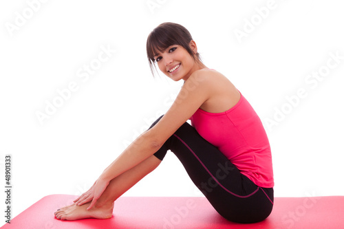 Photo: Beautiful caucasian fitness woman stretching Beautiful caucasian fitness woman stretching