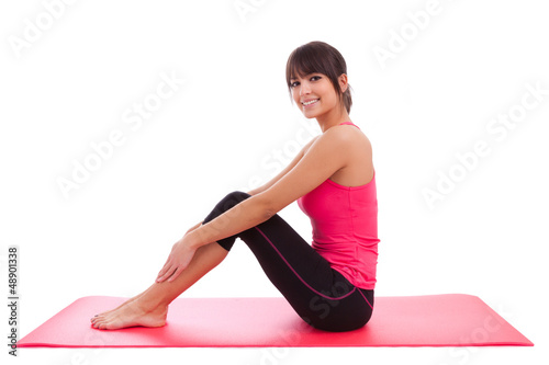 Photo: Beautiful caucasian fitness woman stretching Beautiful caucasian fitness woman stretching