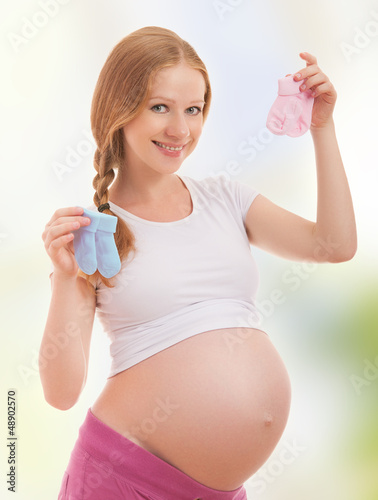 Photo: happy pregnant woman and pink socks happy pregnant woman and pink socks