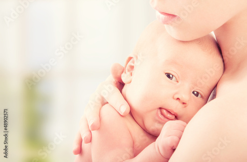 Photo: newborn baby in the arms of mother newborn baby in the arms of mother