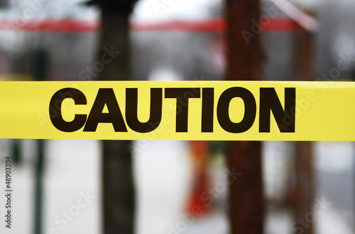 Photo: Caution sign tape concept of warning and danger Caution sign tape concept of warning and danger