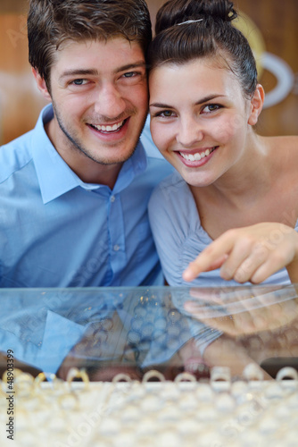 Photo: happy young couple in jewelry store happy young couple in jewelry store