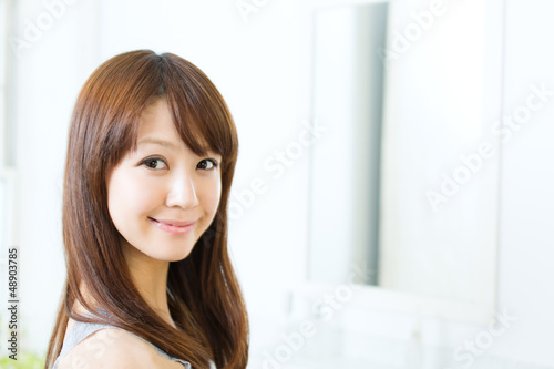 Photo: Beautiful asian woman relaxing in the bathroom Beautiful asian woman relaxing in the bathroom