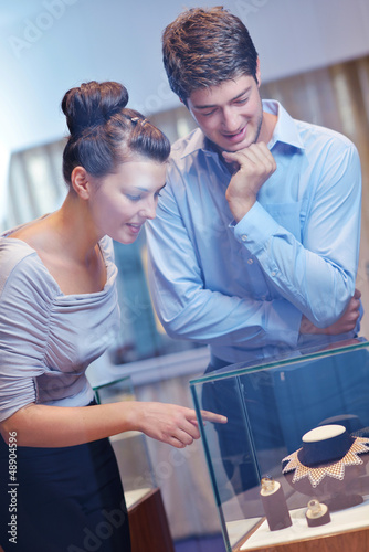 Photo: happy young couple in jewelry store happy young couple in jewelry store