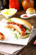 Hot Dog with sausage, ketchup and lettuce