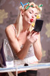 Foto: Housewife irons clothes and makeup corrects Housewife irons clothes and makeup corrects
