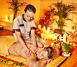Woman getting bamboo massage.