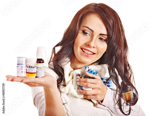 Photo: Woman having pills and tablets. Woman having pills and tablets.