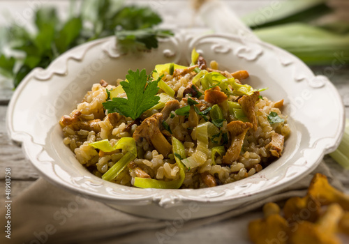 Photo: risotto with mushrooms and leek, selective focus risotto with mushrooms and leek, selective focus