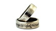 two silver wedding rings with engraved ancient inscriptions