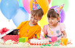 Photo: adorable children celebrate birthday party and opening gift box adorable children celebrate birthday party and opening gift box