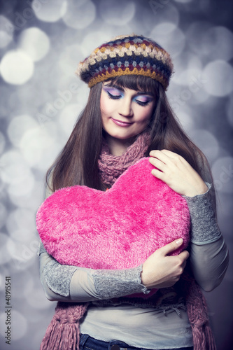 Photo: Beautiful brunette girl with toy heart. Photo for st. Valentine Beautiful brunette girl with toy heart. Photo for st. Valentine