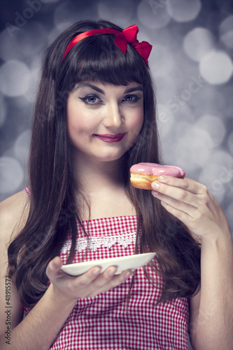 Photo: Style girl with cake and bokeh at background. Style girl with cake and bokeh at background.