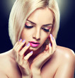 Beautiful blonde girl with lilac makeup