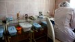 Little girl sit at doctors table in front of window