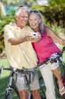 Photo: Senior Couple Bicycles Taking Digital Camera Picture Senior Couple Bicycles Taking Digital Camera Picture