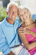 Happy Senior Couple Smiling Outside in Sunshine