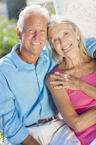 Photo: Happy Senior Couple Smiling Outside in Sunshine Happy Senior Couple Smiling Outside in Sunshine
