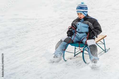 Photo: Boy sledding Boy sledding