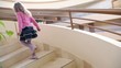 Video: Little girl walks upstairs by circular staircase in multiple Little girl walks upstairs by circular staircase in multiple
