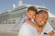 Foto: Mixed Race Father and Son In Front of Cruise Ship Mixed Race Father and Son In Front of Cruise Ship
