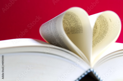 Photo: Pages of a book curved into a heart shape Pages of a book curved into a heart shape